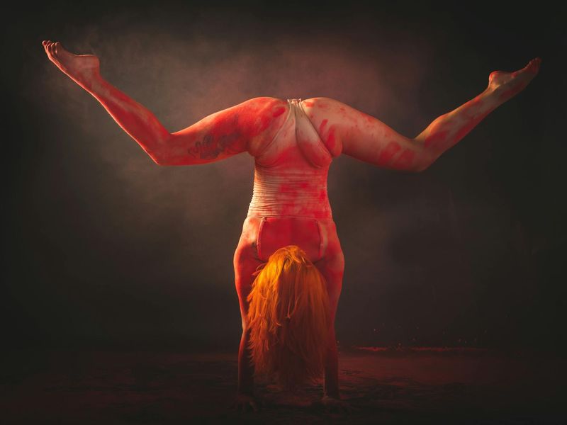 A person in mid-motion, showing fluidity and control during an exercise.