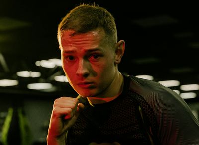 Close-up of a person's focused expression during a workout.